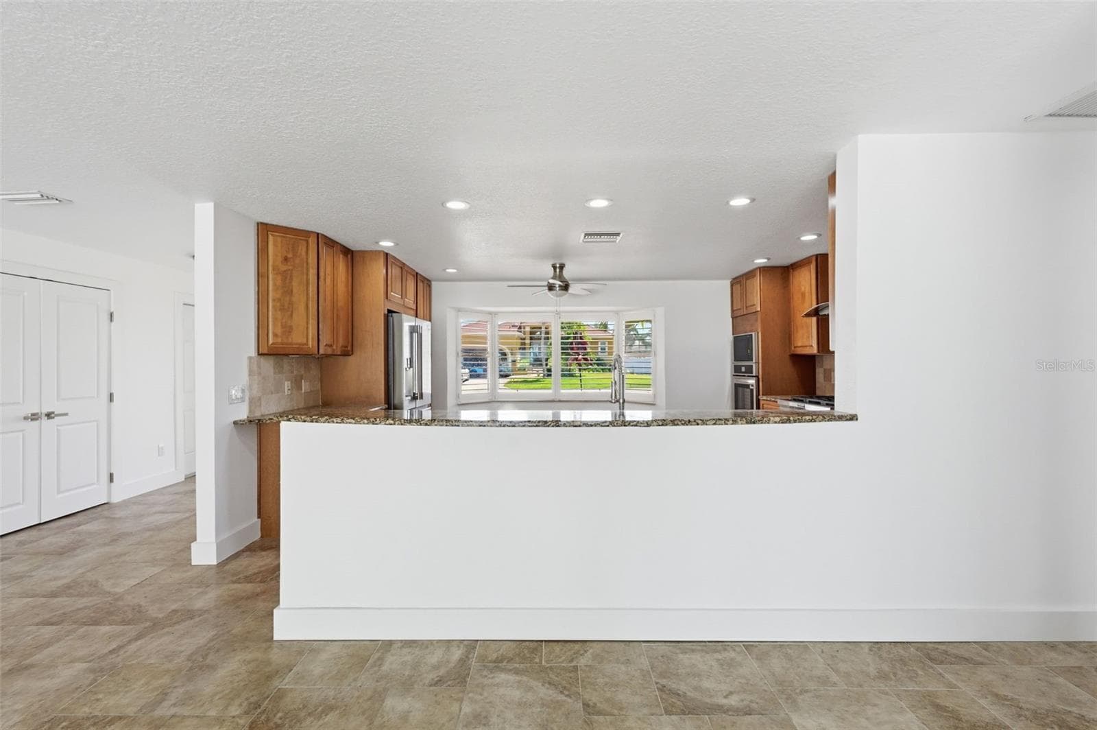 Kitchen from Living Room - 711 64TH AVE, ST PETE BEACH
