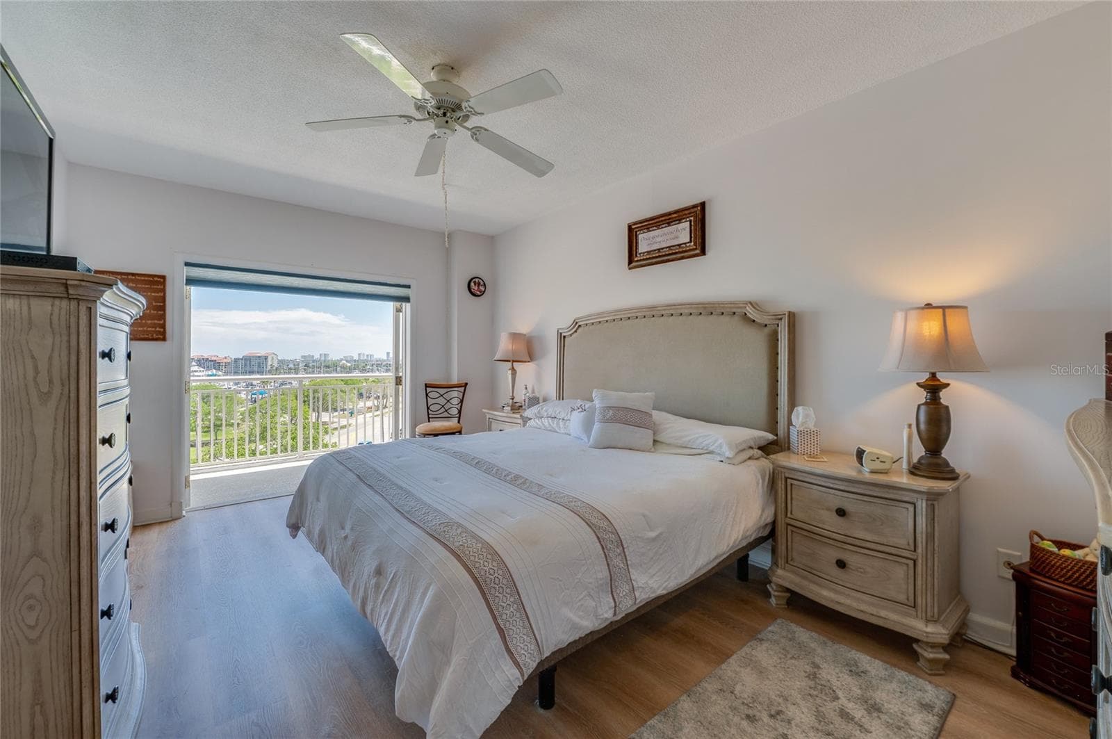 Primary bedroom with private balcony doors open - 404 S BEACH ST #230 (604), DAYTONA BEACH