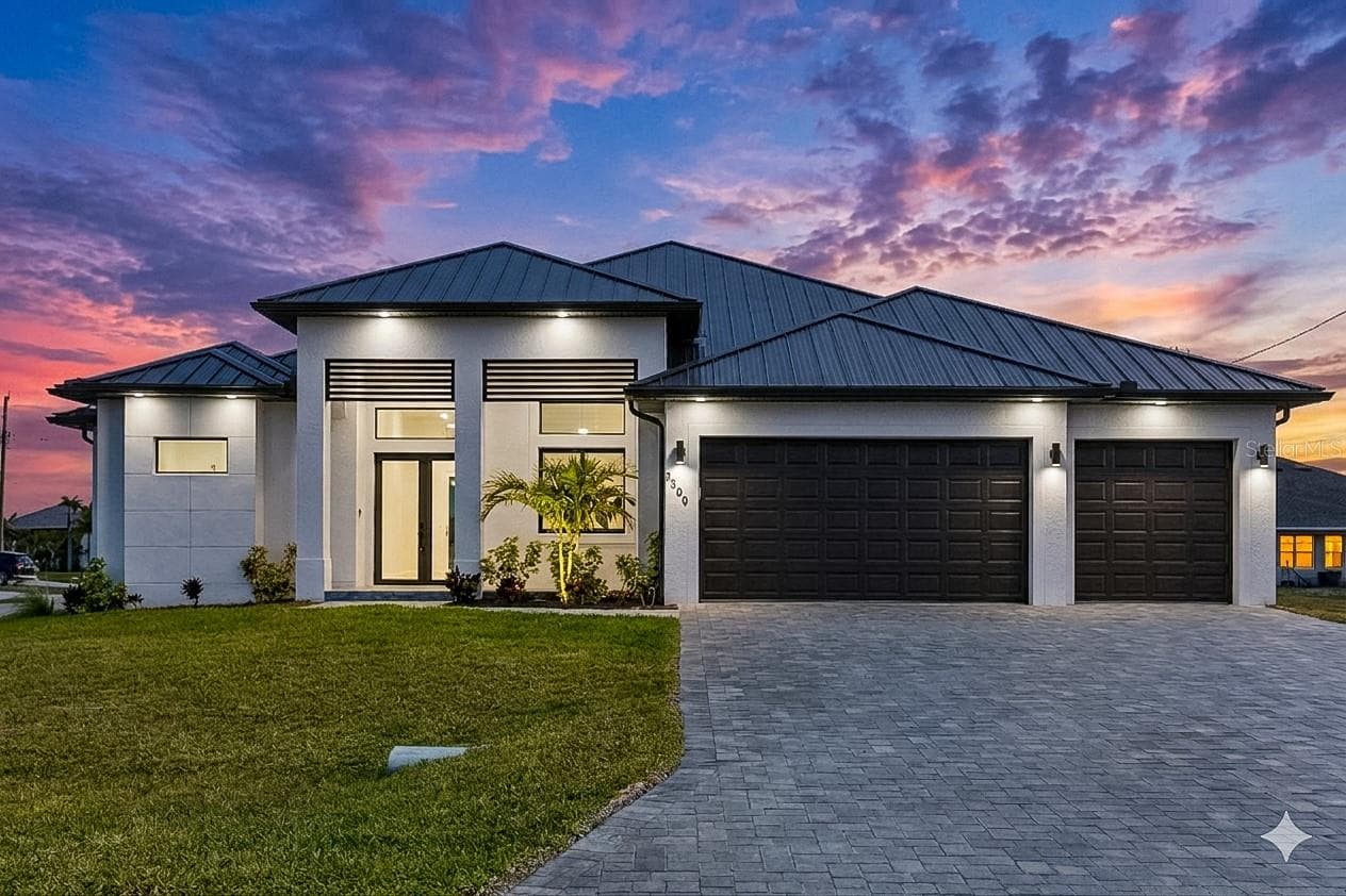 This 2,420 sq ft luxury residence features bright open floor plan w/ 3 beds + flex den + 3.5 baths, designed for MODERN FLORIDA LIVING! - 3300 NW 1ST TER, CAPE CORAL