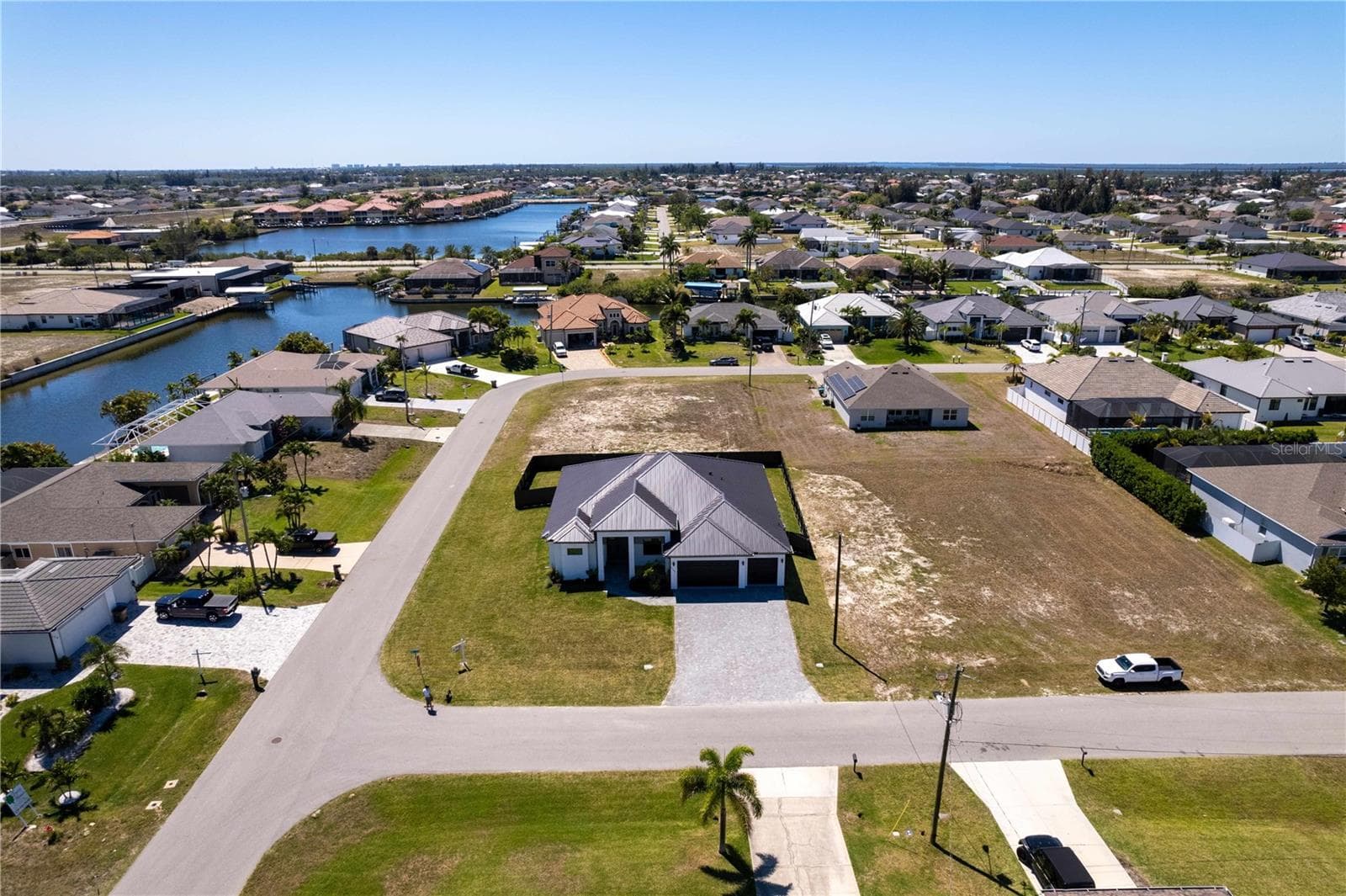 Plenty of space to PARK YOUR BOAT or TRAILER INSIDE FENCED YARD w/ additional ROOM to expand your outdoor living! - 3300 NW 1ST TER, CAPE CORAL
