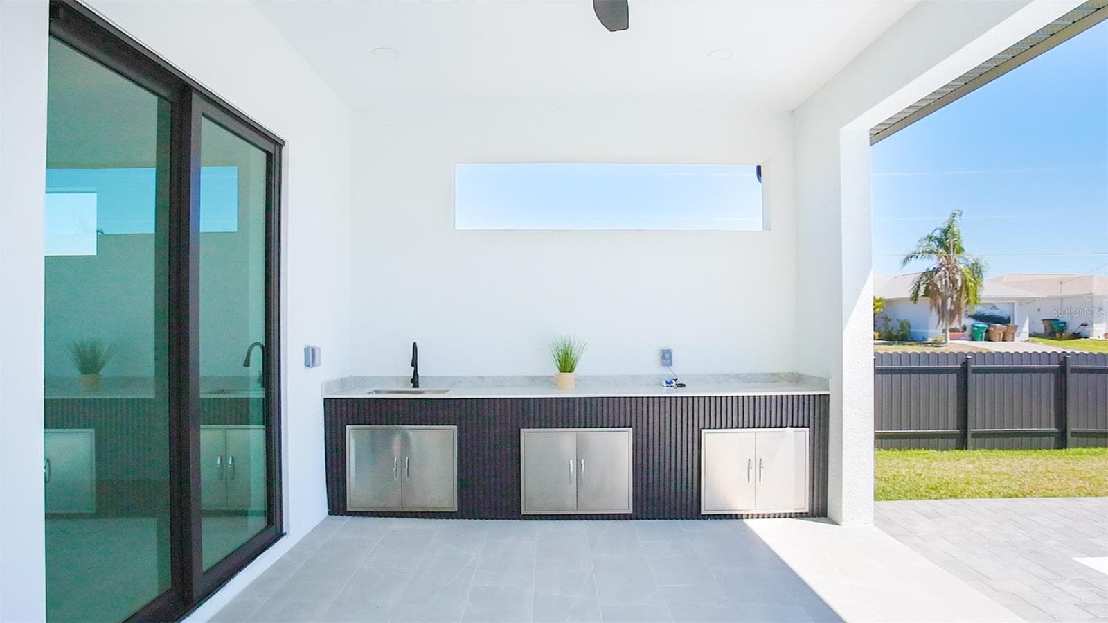 Enjoy your LANAI & PRIVATE POOL AREA w/ dedicated EXPANSIVE COUNTERTOP SPACE w/ 3 STORAGE AREAS & COMMERCIAL-GRADE SINK, perfect for alfresco dining & entertaining year-round. - 3300 NW 1ST TER, CAPE CORAL