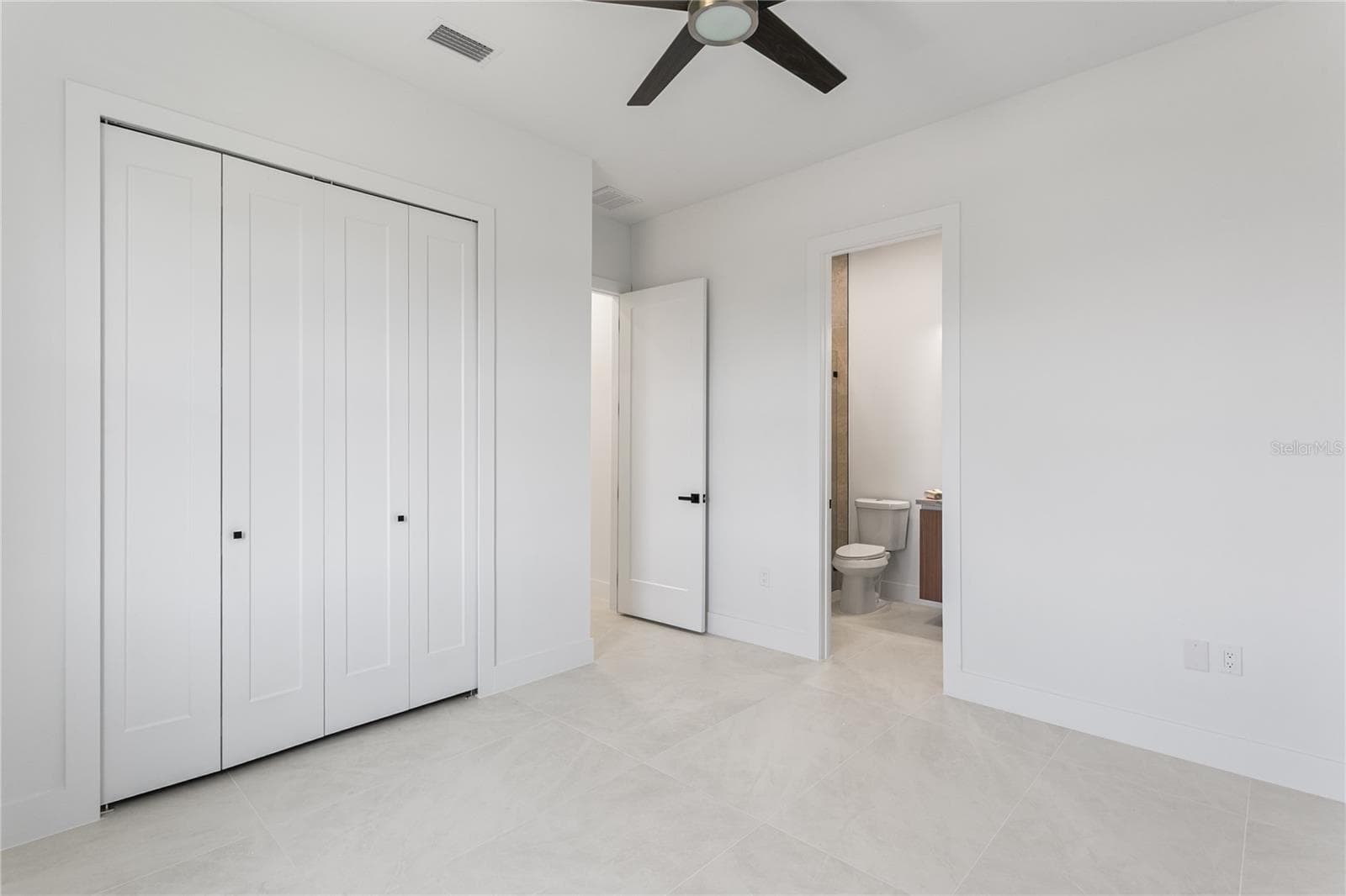 SPLIT FLOOR PLAN PROVIDES privacy w/ a SECOND ENSUITE BEDROOM, 3RD GUEST BEDROOM & ADDITIONAL 3RD BATHROOM in the hallway. - 3300 NW 1ST TER, CAPE CORAL