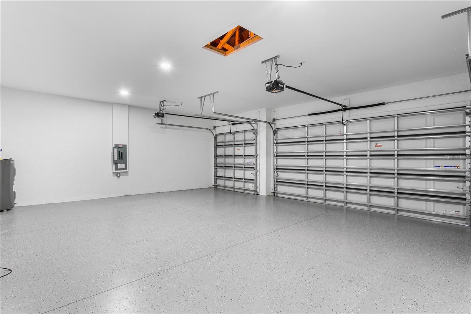 Spacious 3-car garage offers ample room for vehicles, storage, and all your Florida lifestyle toys. - 3300 NW 1ST TER, CAPE CORAL