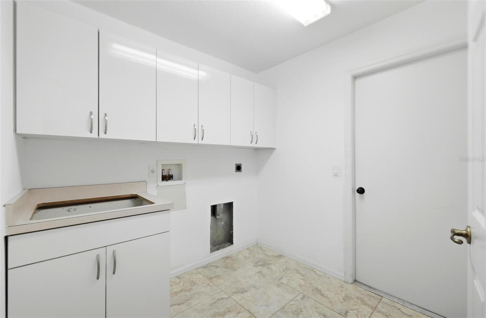 Spacious laundry room with ample storage and move-in ready condition, includes new washer/dryer (2024) - 605 ROTONDA CIR, ROTONDA WEST