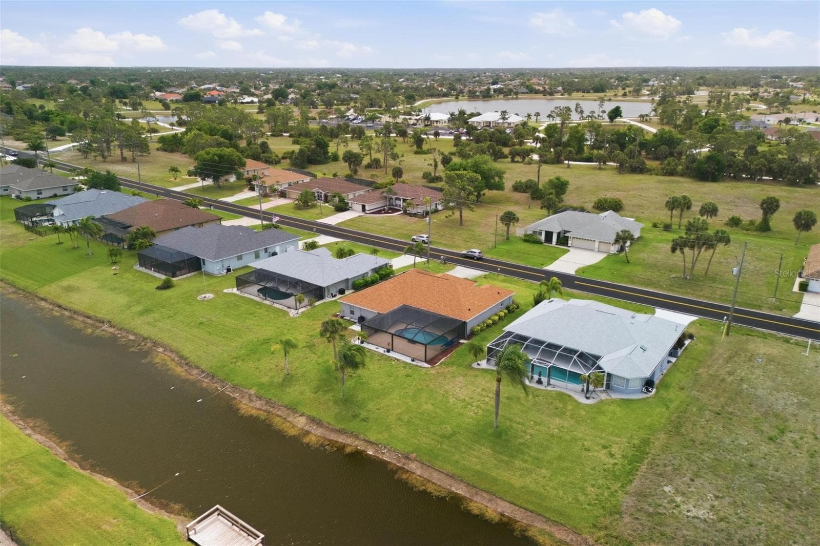 Aerial perspective showing owned solar panels (2025), new roof (2023), and pool area - 605 ROTONDA CIR, ROTONDA WEST