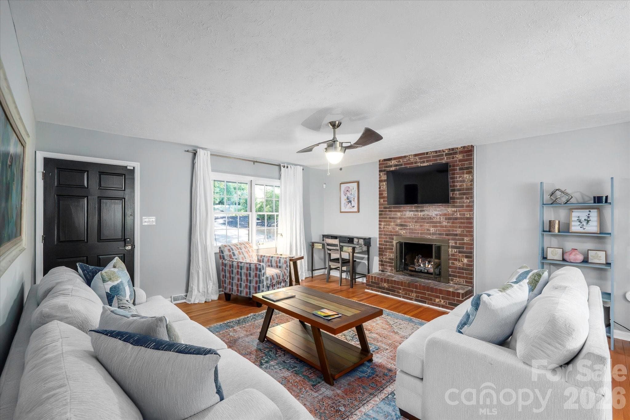 Cozy, inviting living room with gas log fireplace - 23 Springwood Drive, Asheville