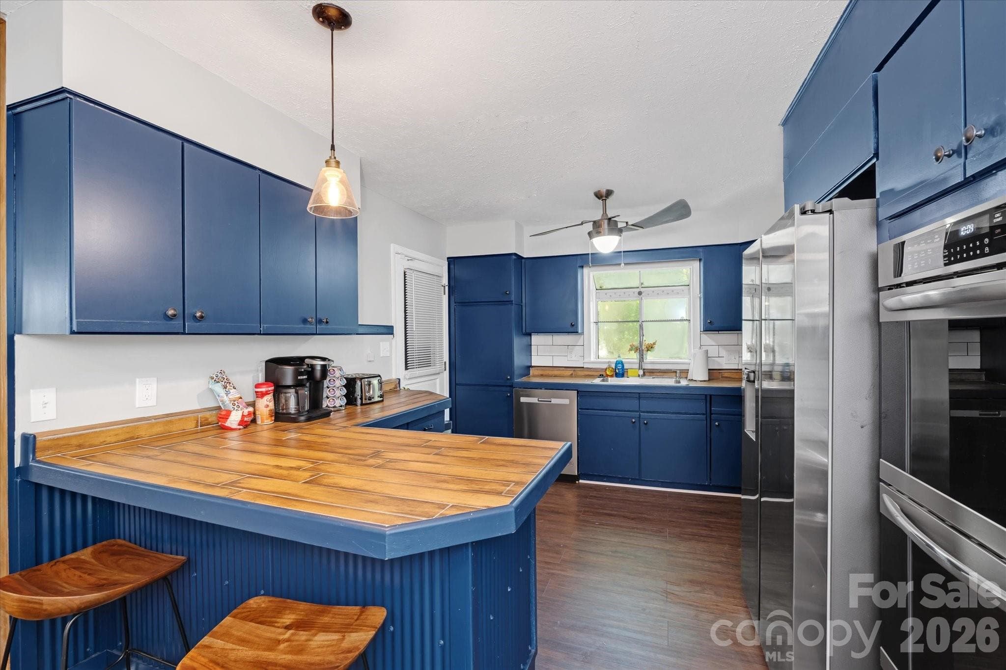 Updated kitchen with new stainless steel appliances - 23 Springwood Drive, Asheville