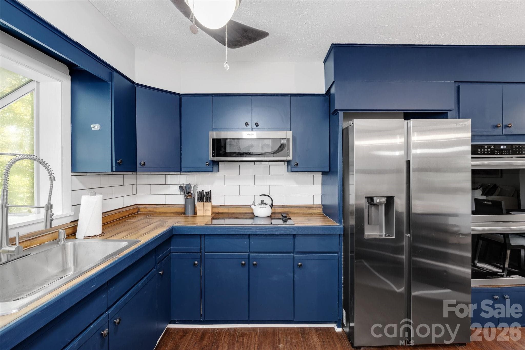 Updated kitchen with new stainless steel appliances - 23 Springwood Drive, Asheville