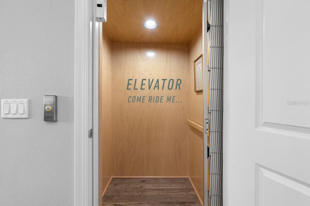 Elevator from garage to kitchen and then the bedroom floor. - 6057 MOORINGS DR S, ST PETERSBURG