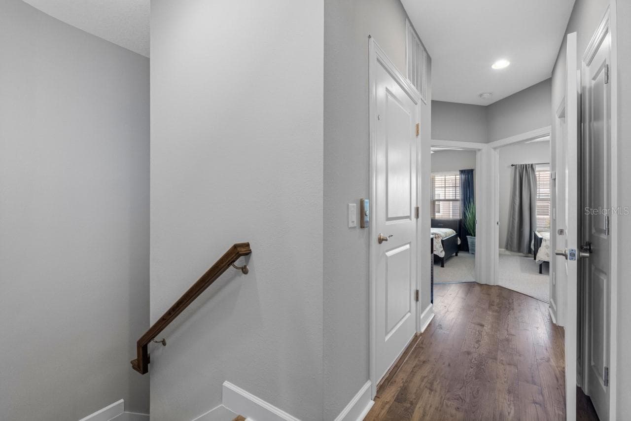 Elevator door and hall to 2nd and 3rd bedrooms - 6057 MOORINGS DR S, ST PETERSBURG