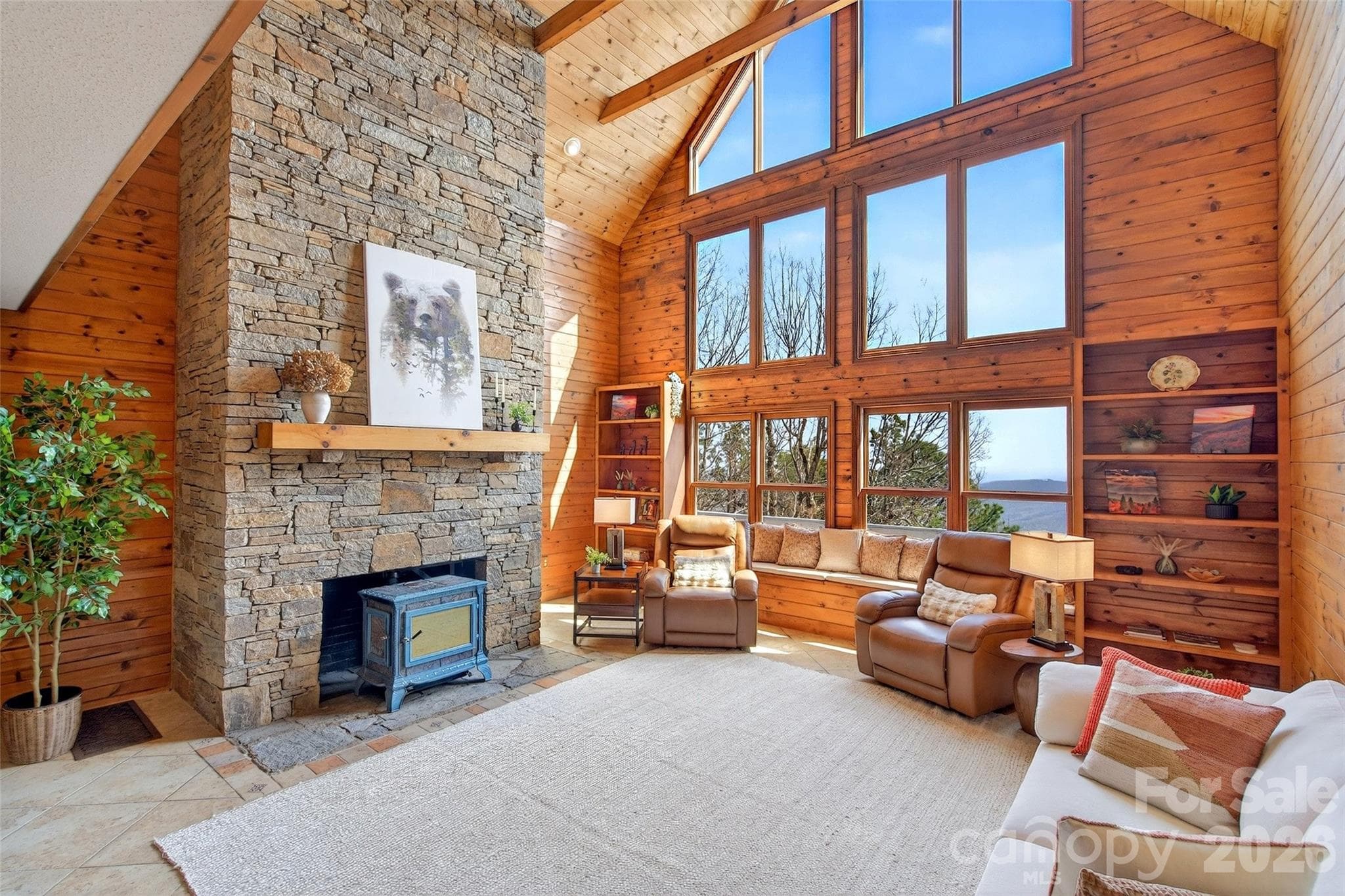 Handcrafted floor-to-ceiling wood stove fireplace. - Old Fort