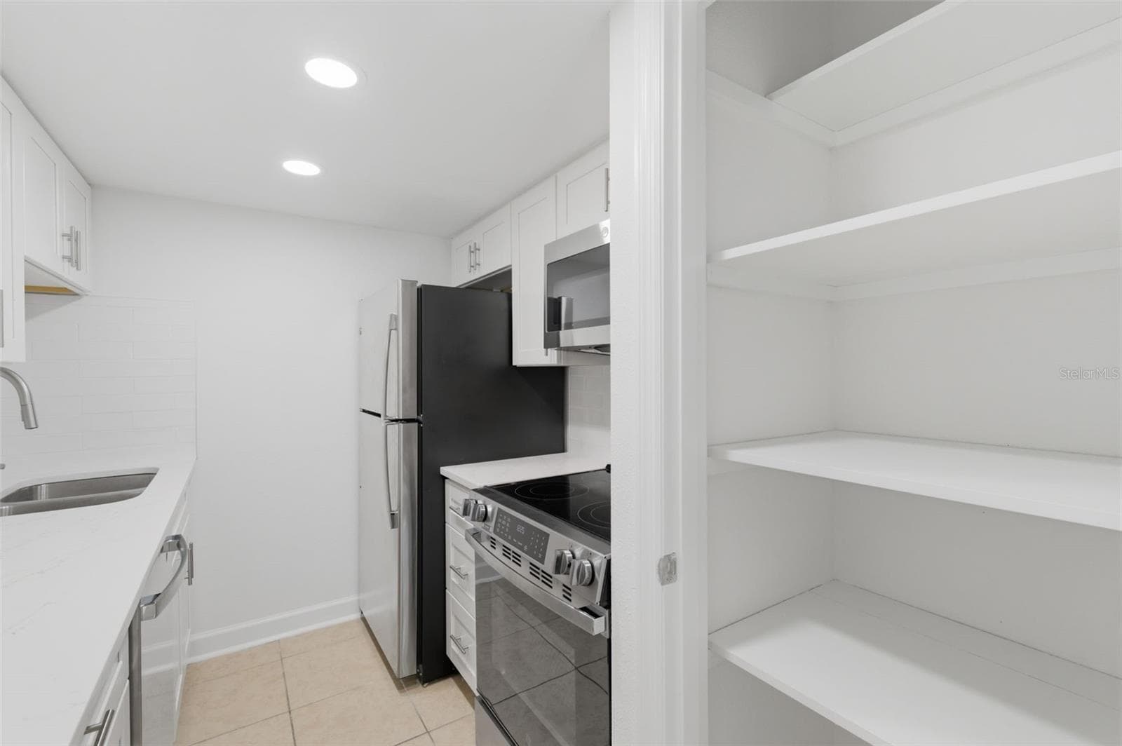 Nice shelved pantry for storing groceries and small appliances - 8901 BLIND PASS RD #127, ST PETE BEACH