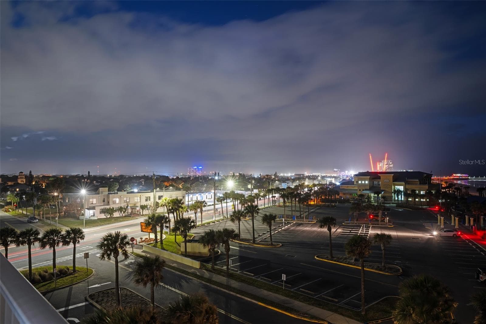 Night shot of the city from the balcony - 701 S ATLANTIC AVE #516, DAYTONA BEACH