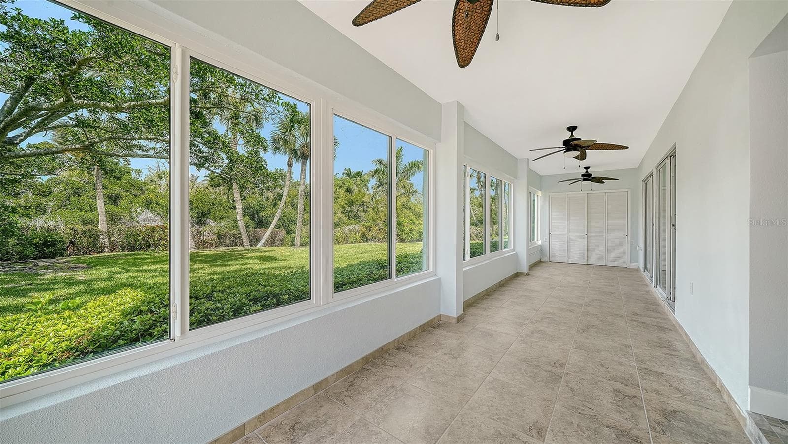 The view east into the lanai that runs the length of the unit. - 225 HOURGLASS WAY #106, SARASOTA