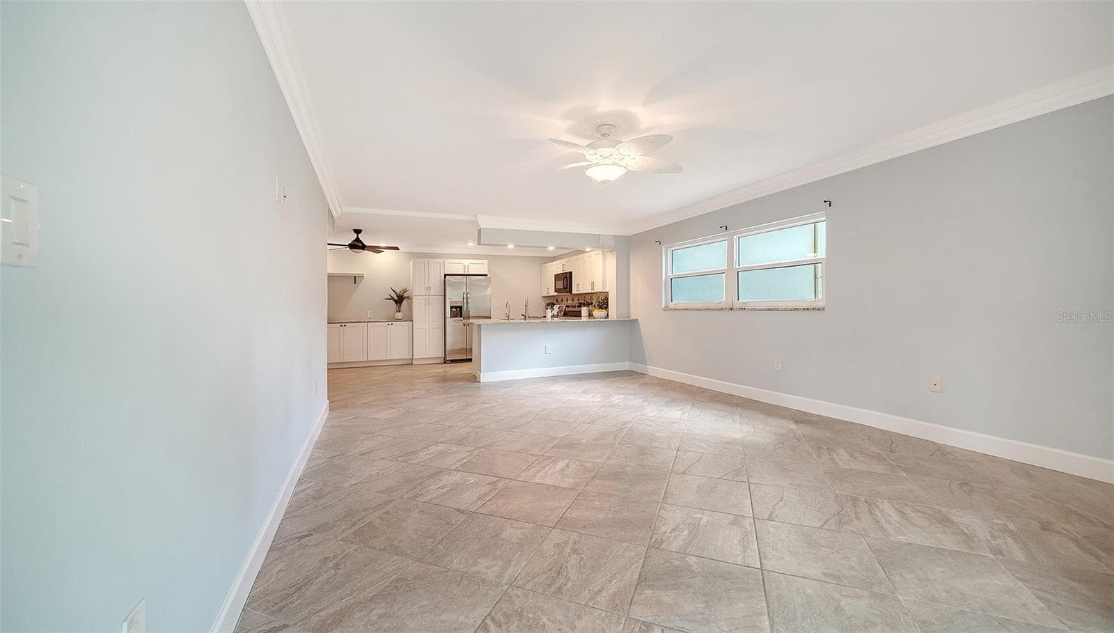 The view from the lanai into the living room and kitchen. - 225 HOURGLASS WAY #106, SARASOTA