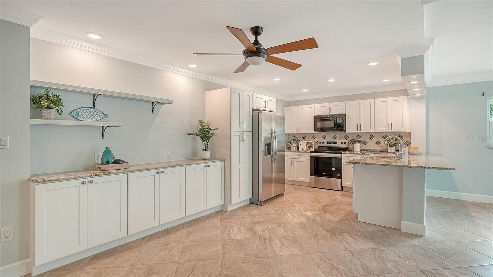 Wall of built-ins for extra storage along the dining room wall. - 225 HOURGLASS WAY #106, SARASOTA