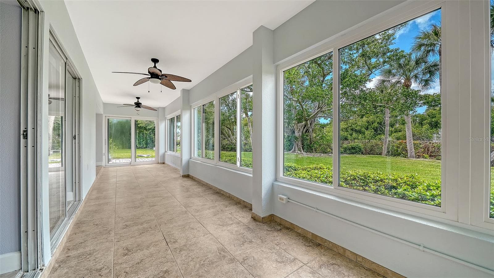 The view to the west in the lanai. - 225 HOURGLASS WAY #106, SARASOTA