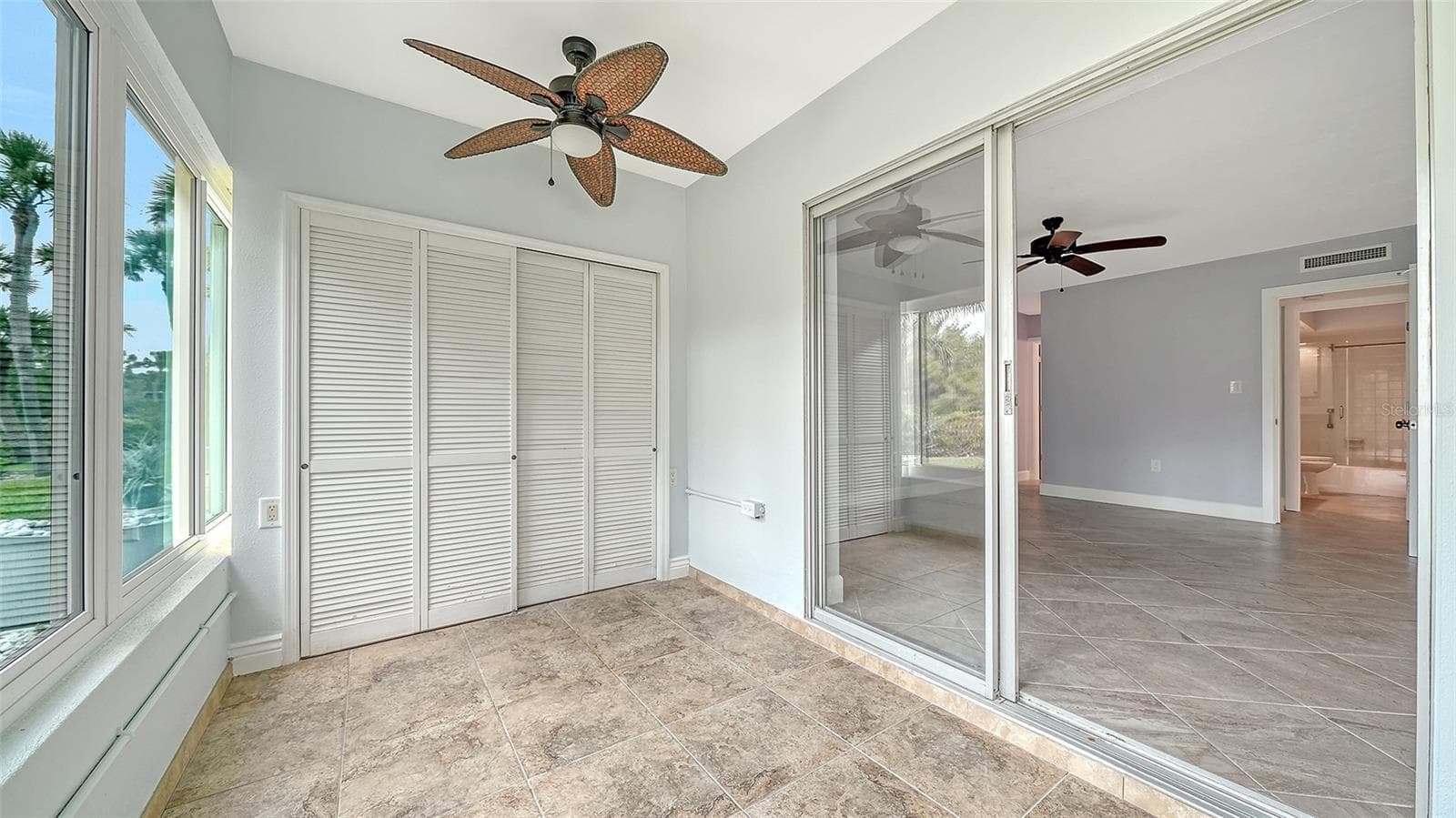 The lanai contains a rare built-in storage closet outside of the primary bedroom. - 225 HOURGLASS WAY #106, SARASOTA