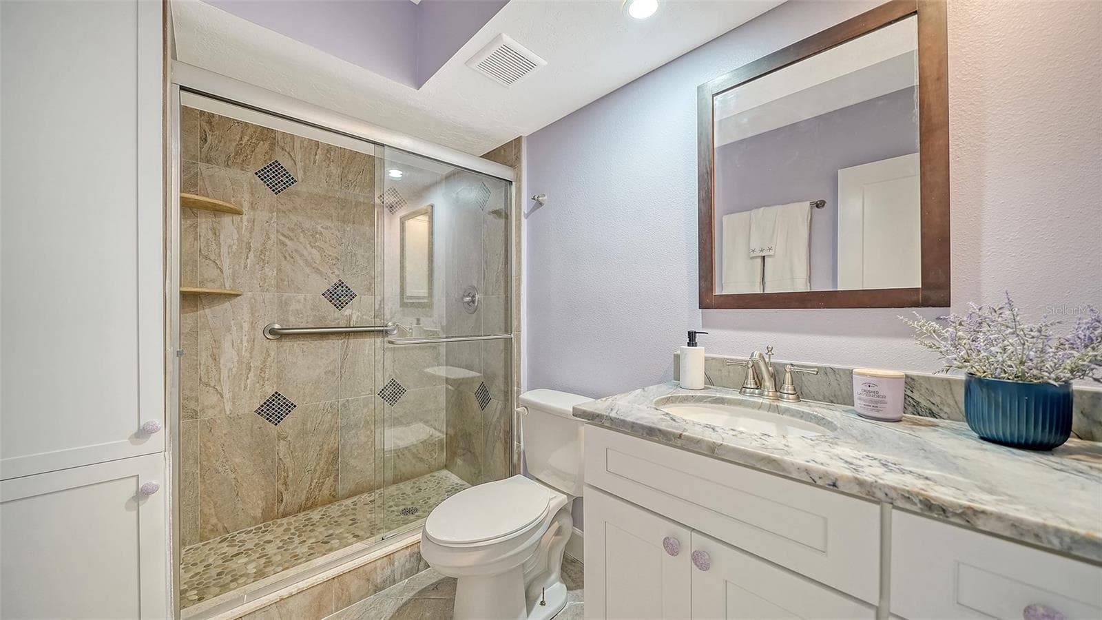 Primary bathroom with granite counters & glassed walk-in shower. - 225 HOURGLASS WAY #106, SARASOTA