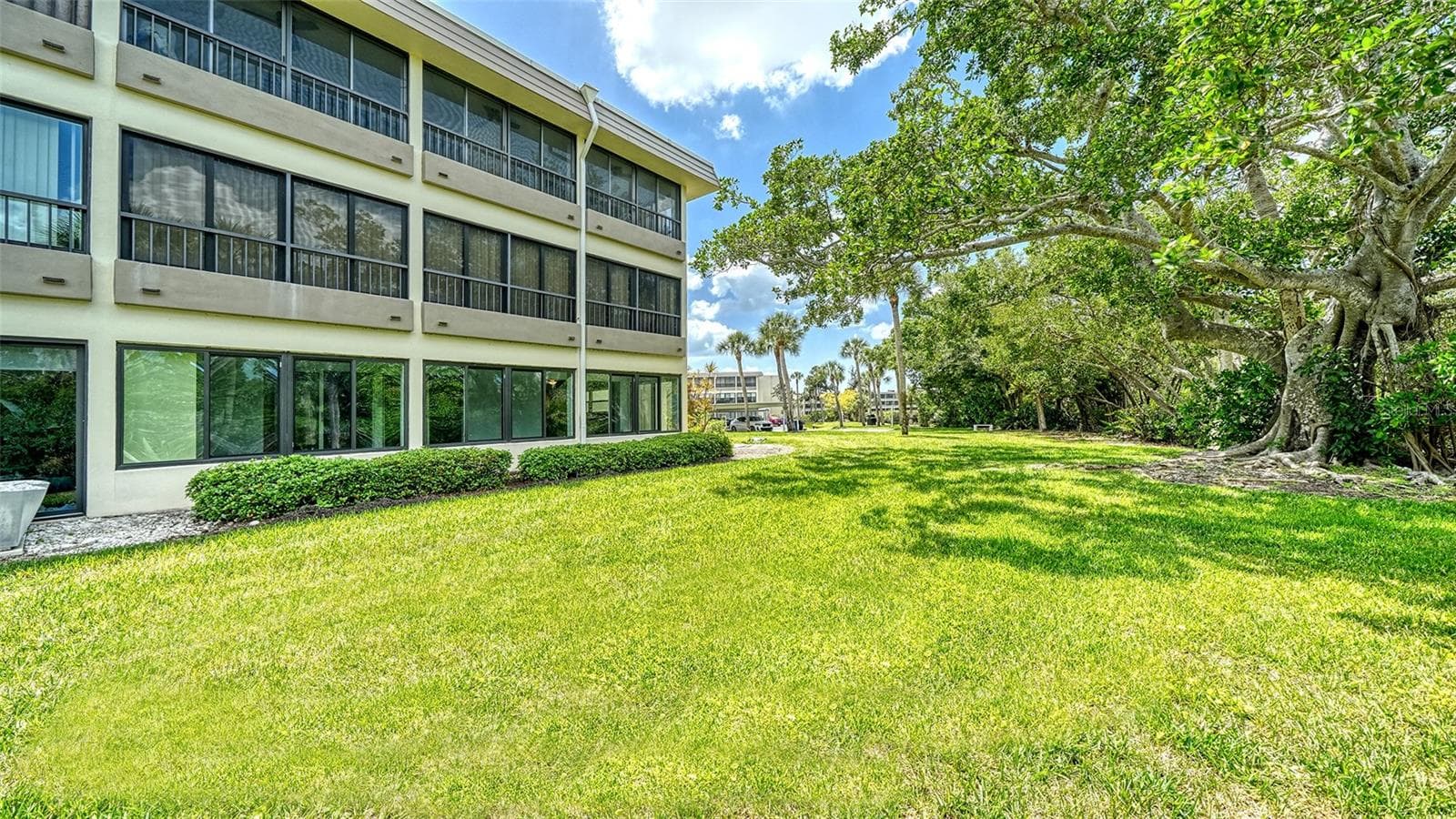 The exterior back of the building and unit. - 225 HOURGLASS WAY #106, SARASOTA