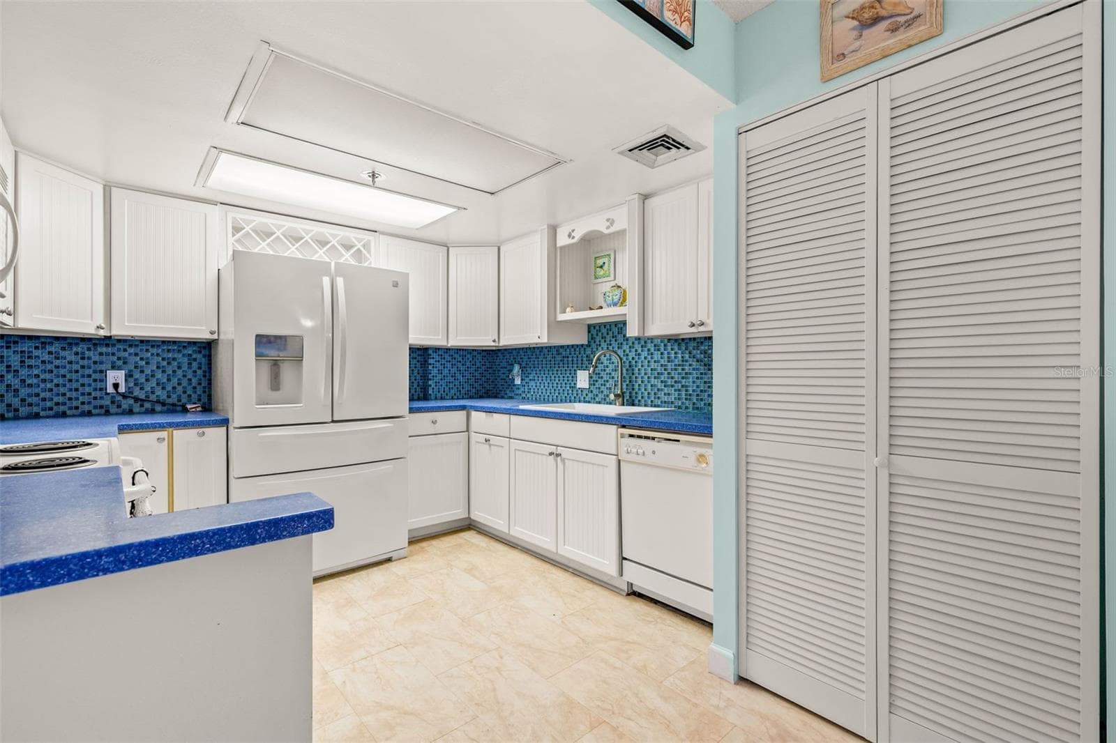 Louvred Doors at Right contain washer - dryer - 1 KEY CAPRI #102E, TREASURE ISLAND