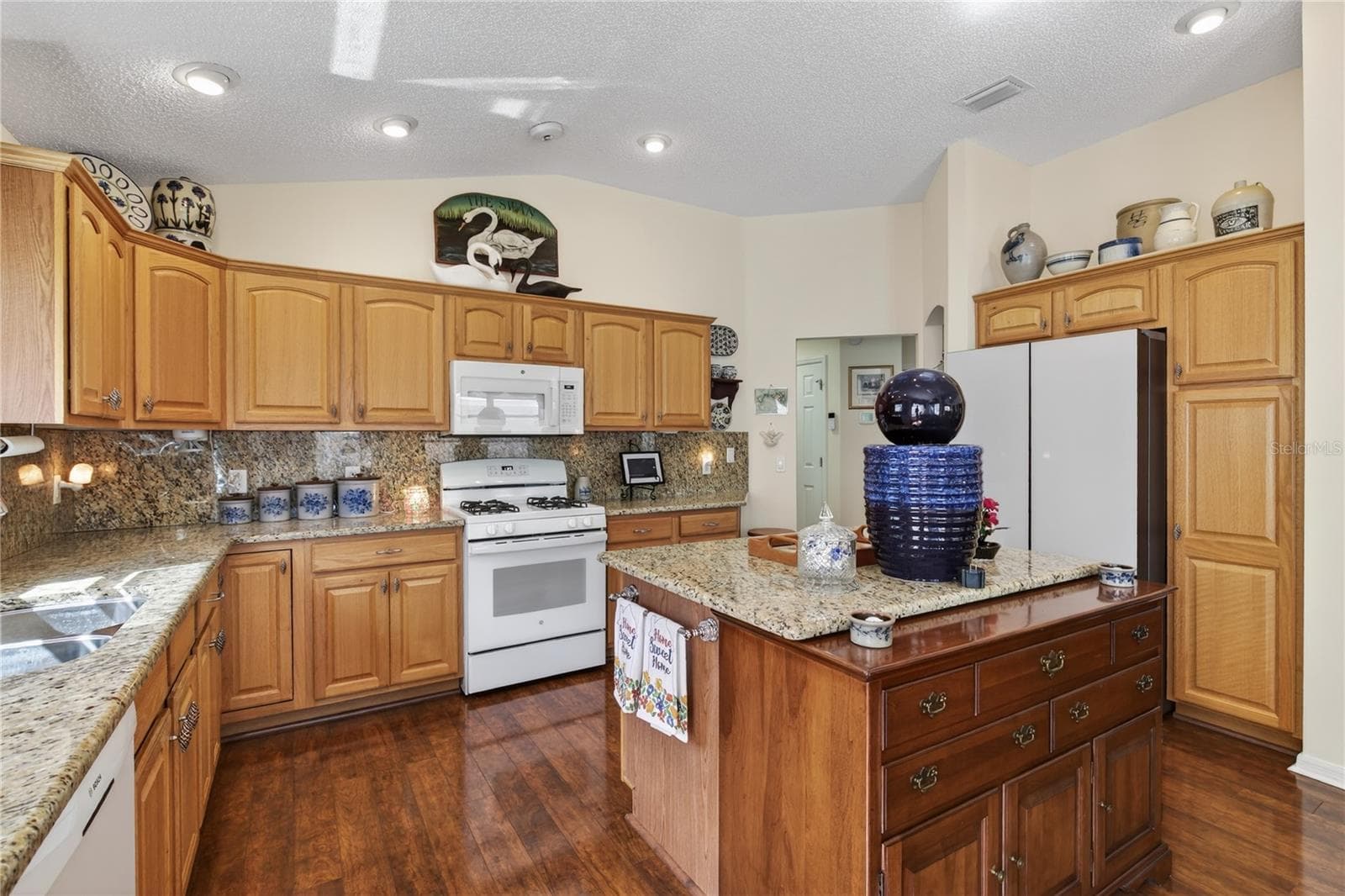 NEW GLASS REFRIGERATOR, NEW MICROWAVE, NEW GAS STOVE, KITCHEN STAINLESS STEEL PULL DOWN  FAUCET - 1147 ELIZABETH CT, THE VILLAGES