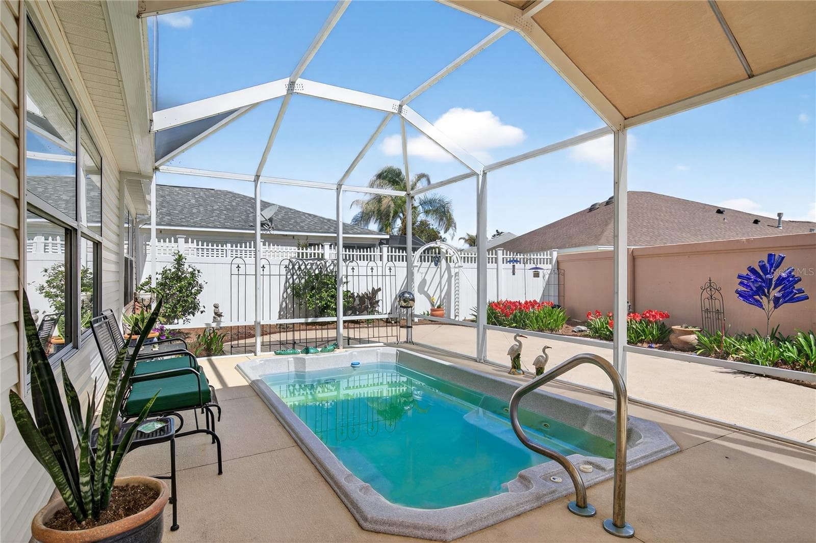 Unwind and rejuvenate in our inviting heated spa, offering a tranquil escape, or effortlessly maintain your fitness goals with our convenient swimming exercise options; perfect for relaxation and activity. - 1147 ELIZABETH CT, THE VILLAGES