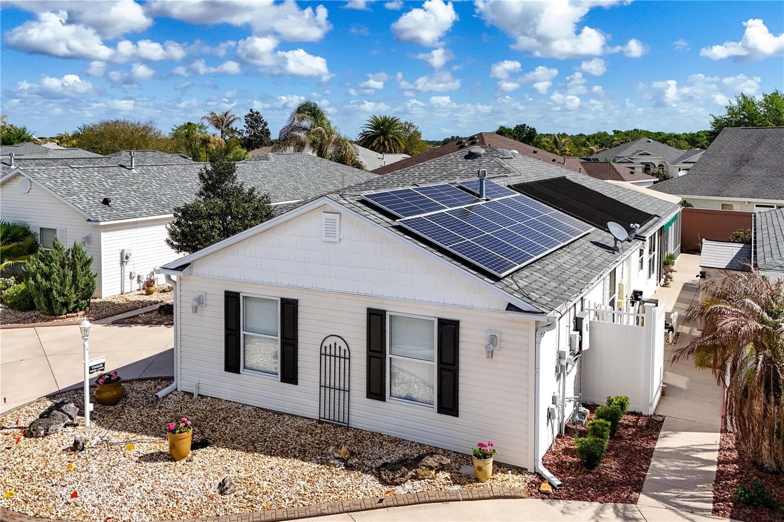 Solar Panels Complete with Generac Power Cell in Garage. This system provides a comprehensive energy solution, ensuring both solar power generation and backup power capabilities. - 1147 ELIZABETH CT, THE VILLAGES
