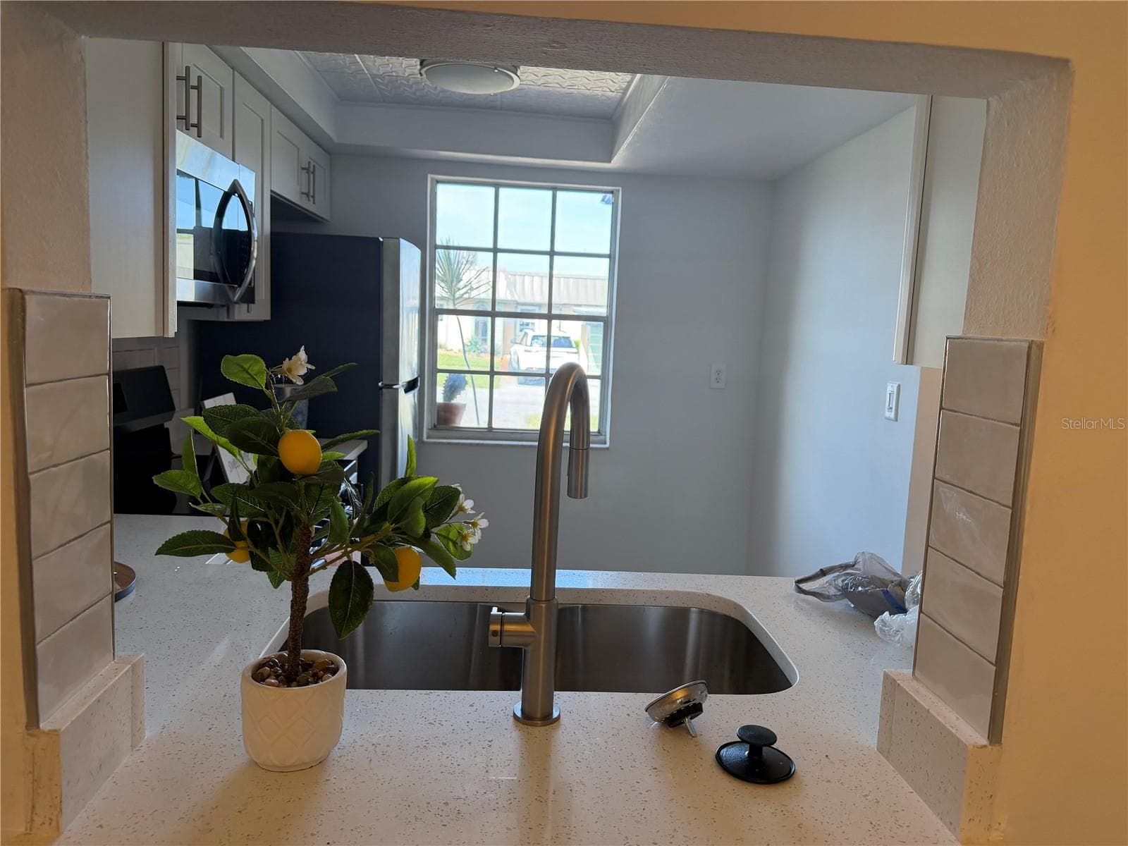 View from Dining Area into Kitchen - 4412 SUNSTATE DR #A, NEW PORT RICHEY