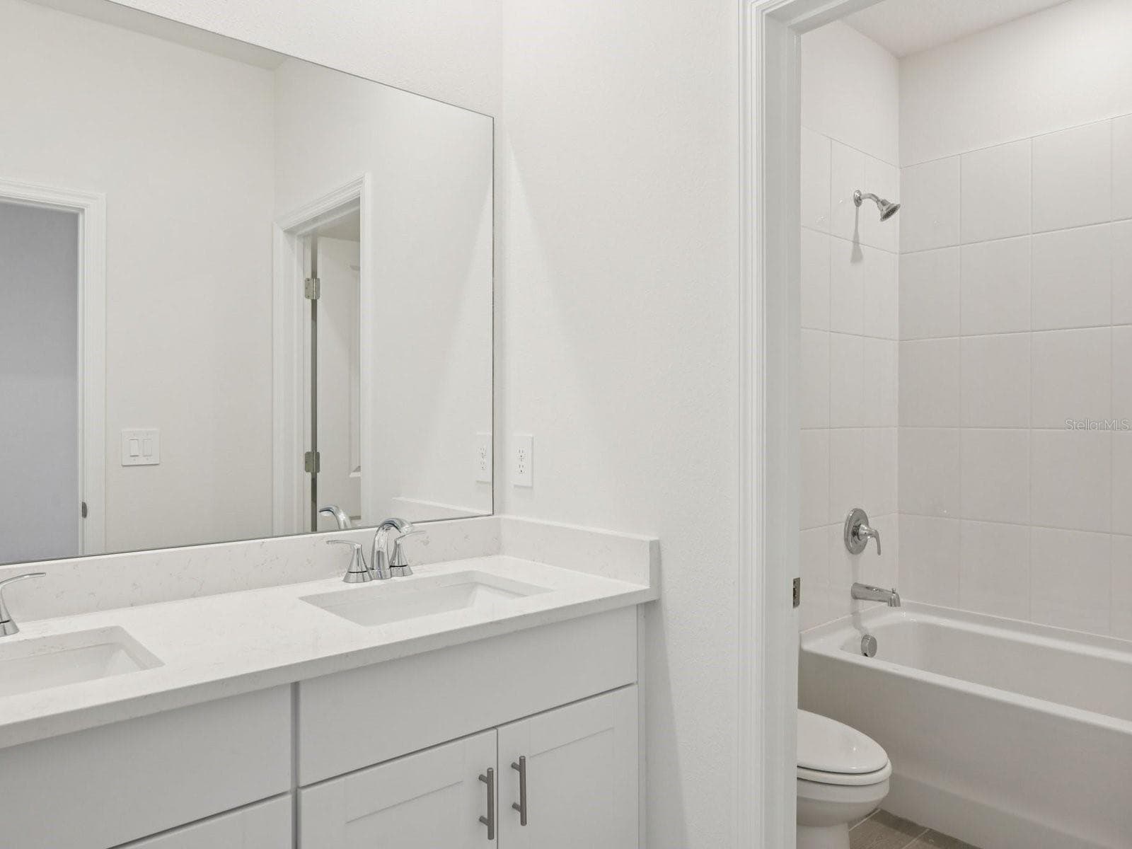 Interior photos are not of the actual home but are photos of the builder home with the same floorplan with similar interior finishes and features. - 9009 VENETIA CT, PALMETTO