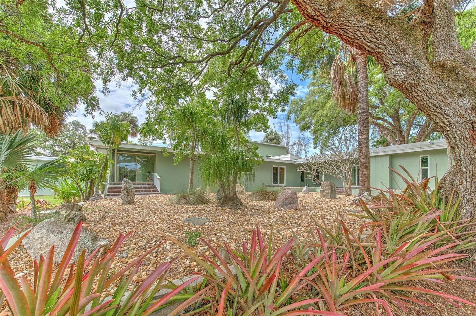 Backyard views of home & rock garden - 7102 MANDY LN, NEW PORT RICHEY