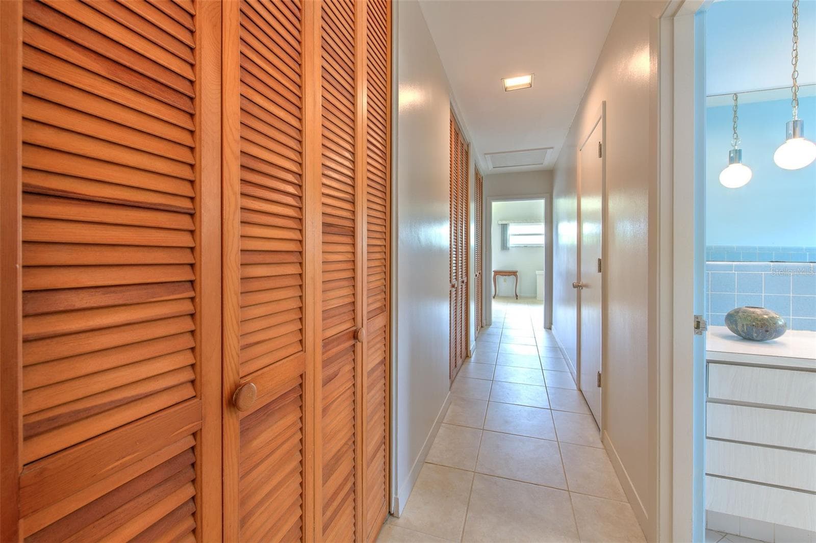 Long hallway with HUGE walk in closets. Tons of storage areas in this home - 7102 MANDY LN, NEW PORT RICHEY