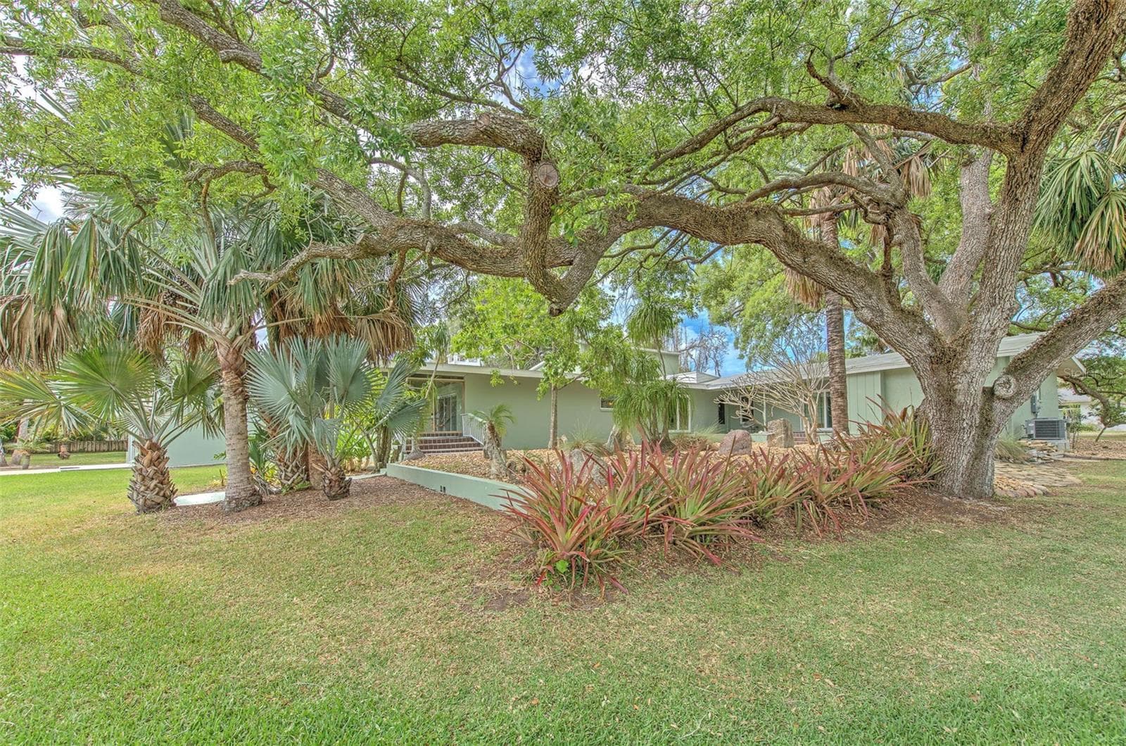 Backyard views of home & rock garden - 7102 MANDY LN, NEW PORT RICHEY