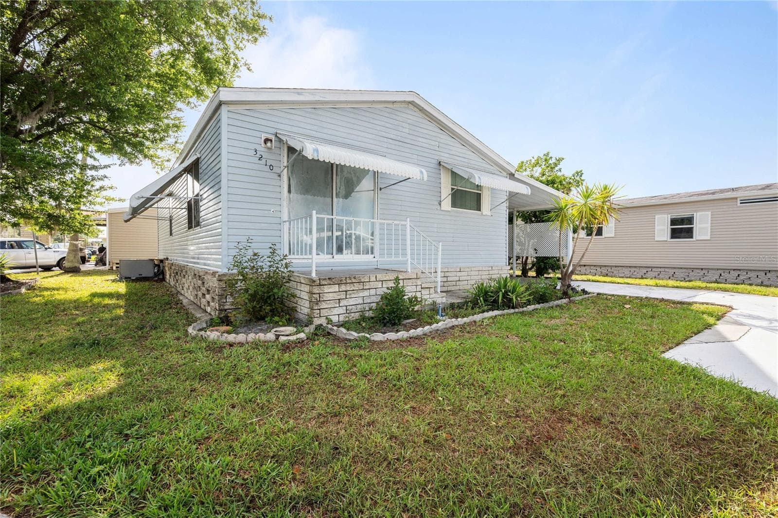 Manufactured Home at 3210 HICKORY DR, WESLEY CHAPEL, photo 6 of 39