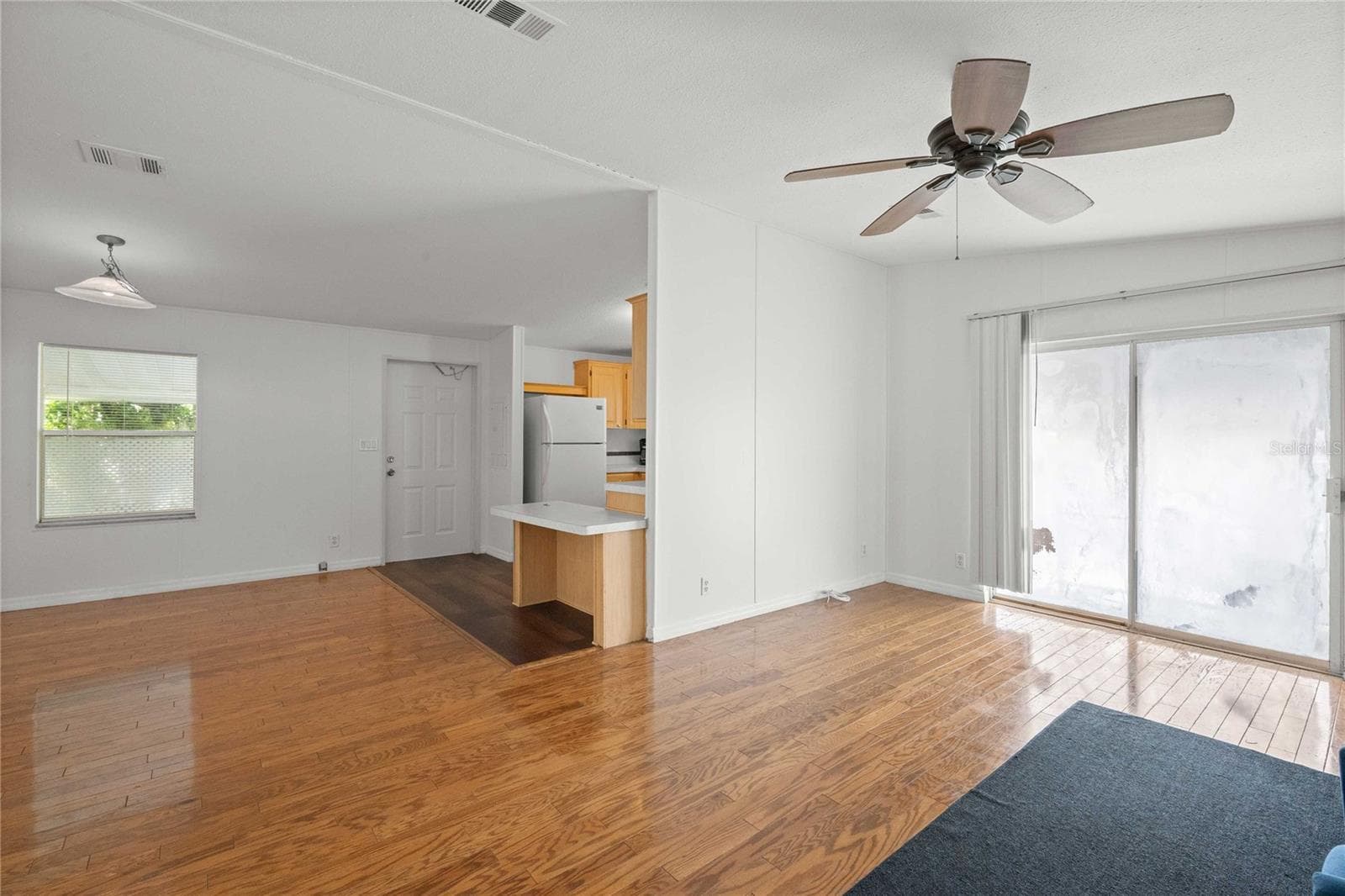 Living room is open concept. - 3210 HICKORY DR, WESLEY CHAPEL