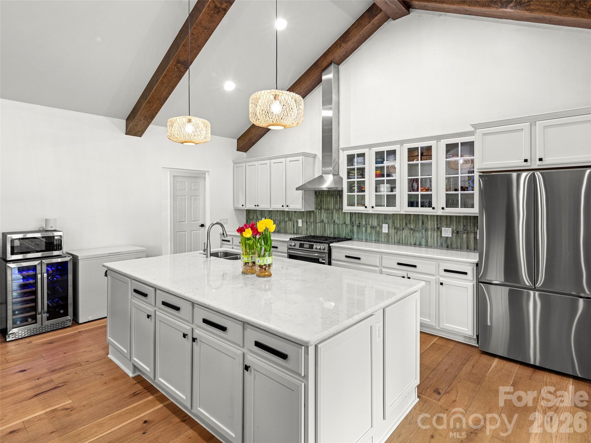 Reconfigured kitchen with brand new counter-depth fridge, green tile backsplash, upgraded fixtures, new lighting - 127 Rockbridge Road, Mills River