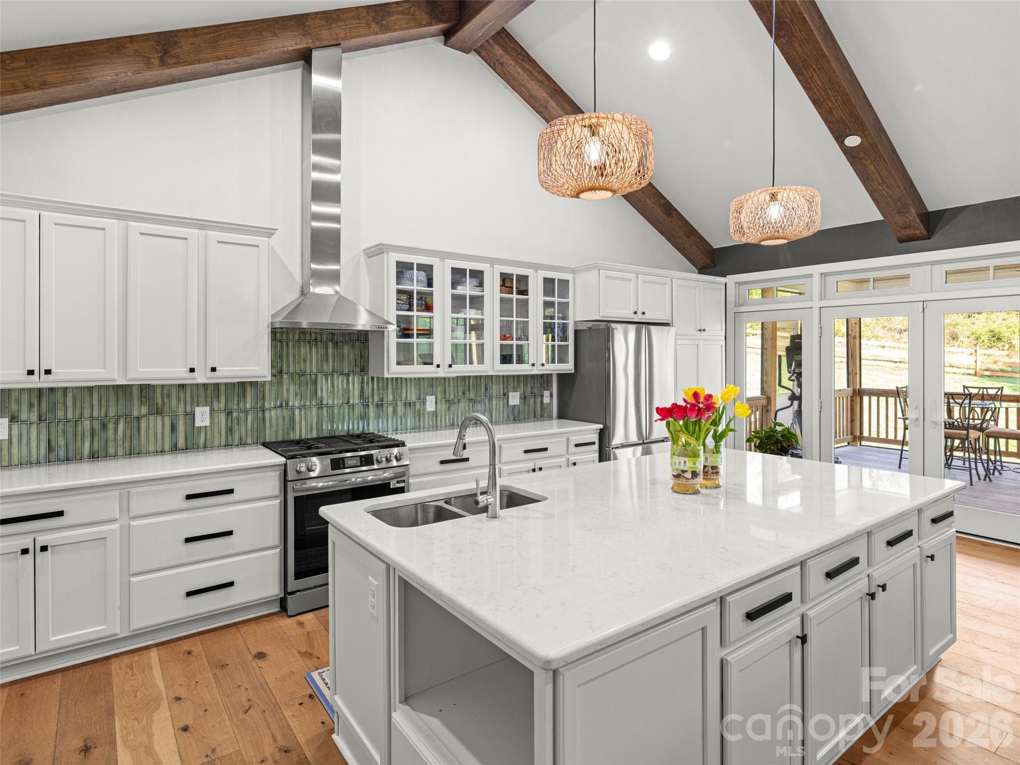Kitchen opens directly to the fully screened in back porch - 127 Rockbridge Road, Mills River