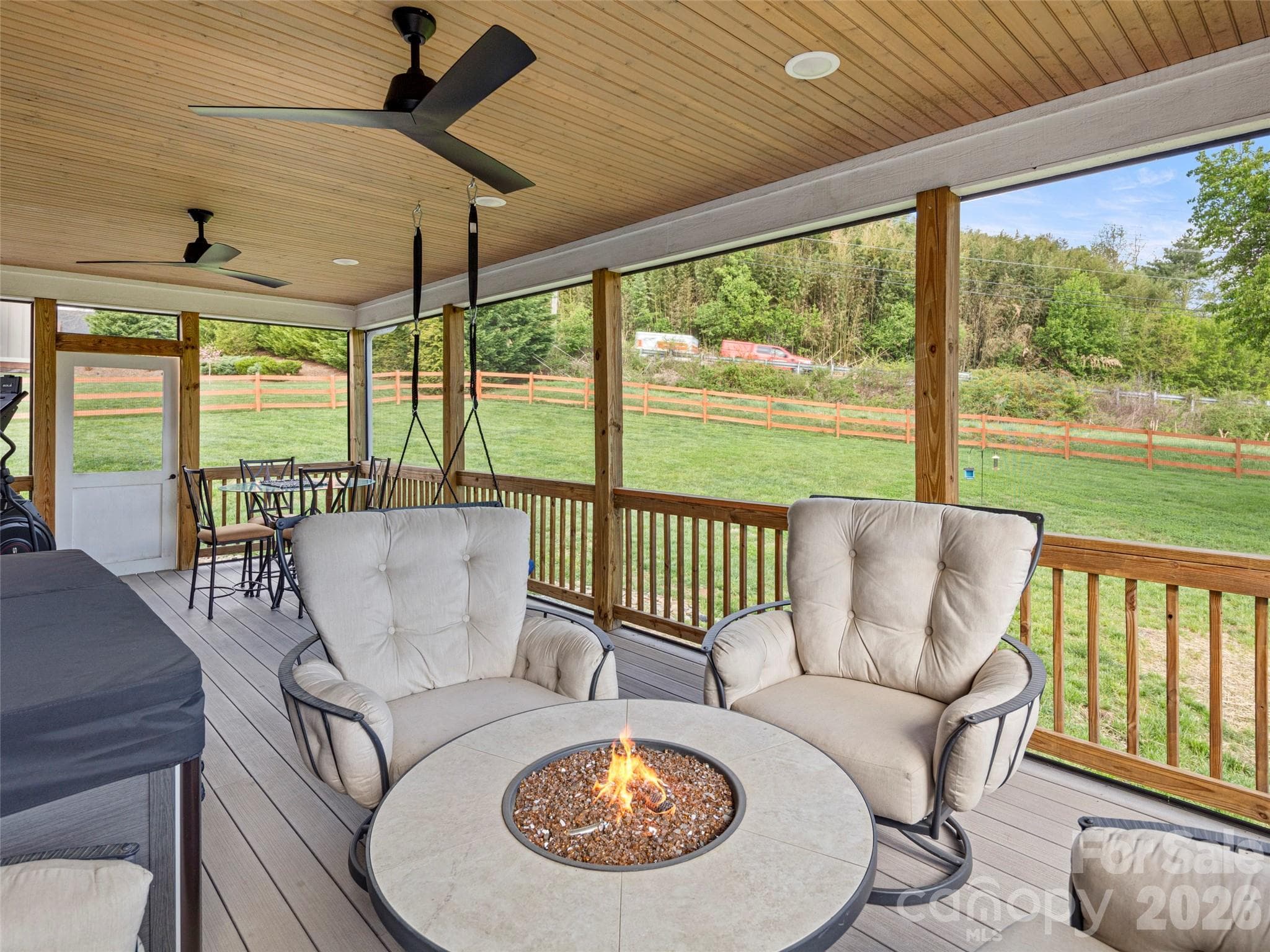 Outdoor living at its absolute finest! Upgraded ceiling fans, added electrical outlet, rebuilt screen door - 127 Rockbridge Road, Mills River