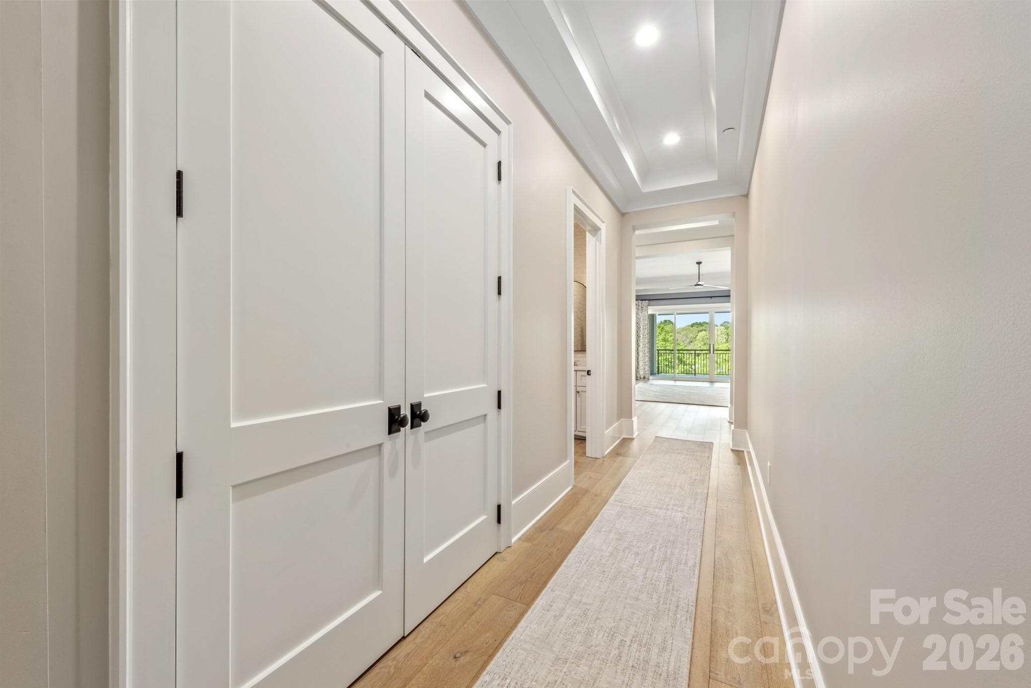 Long hallway between foyer and open living area - 19329 Watermark Drive, Cornelius