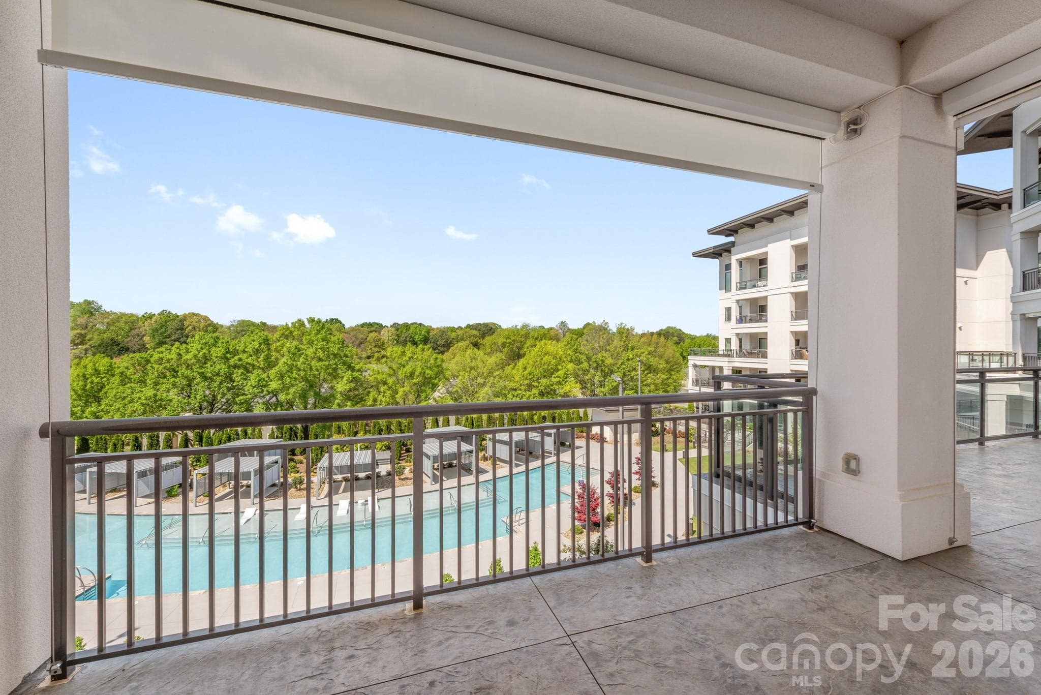 Covered lanai view with electronic shades for privacy - 19329 Watermark Drive, Cornelius