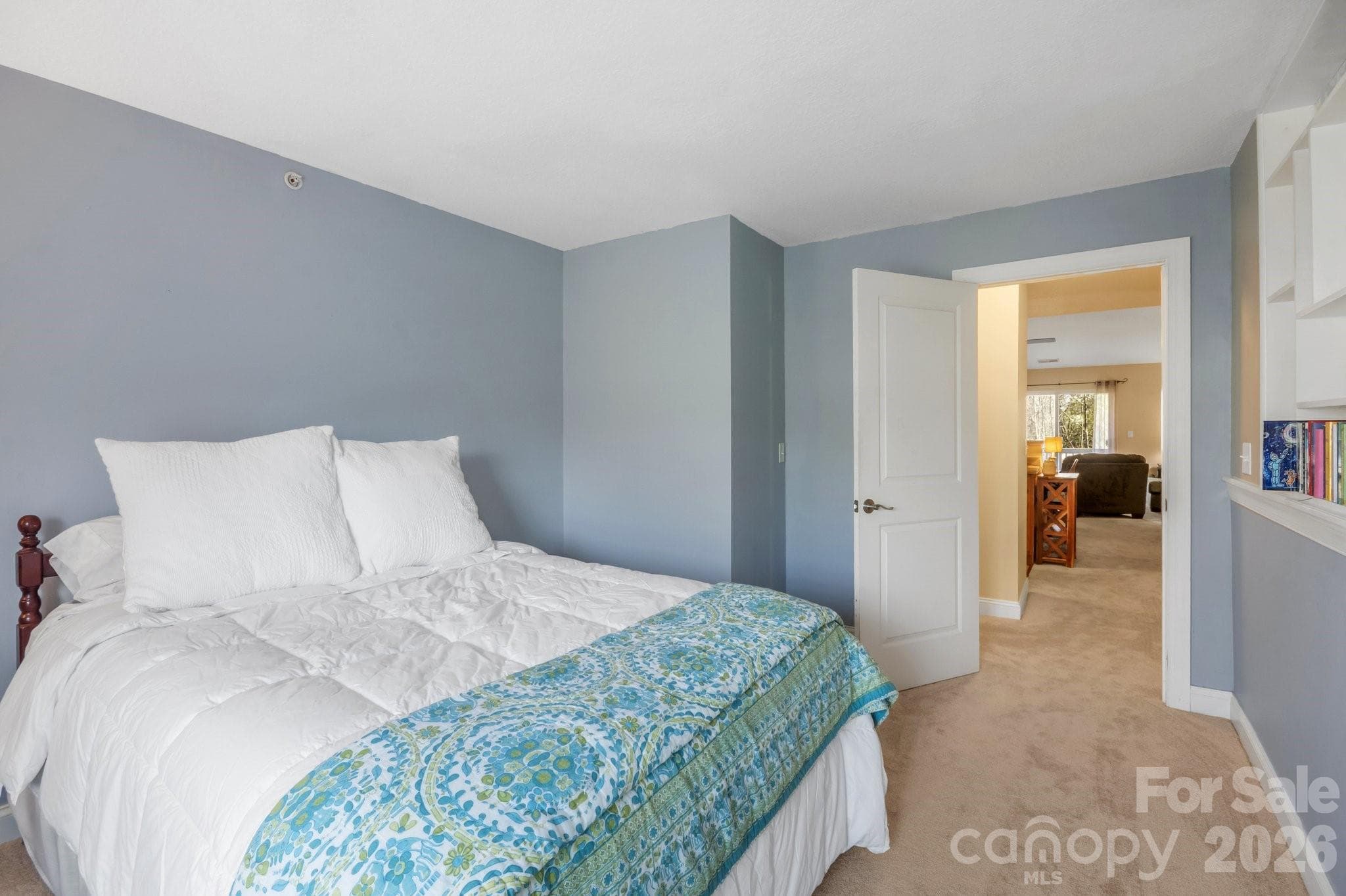 This guest bedrooms door is positioned differently than other units. It allows for the sunlight to flow into the main living space, giving a more bright and open feel - 94 Foxden Drive, Fletcher