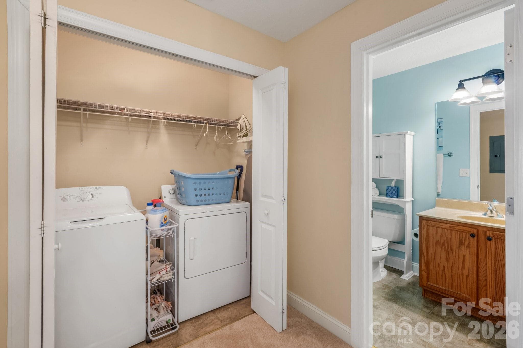 Laundry is located in the hall where there is plenty of space to get the job done - 94 Foxden Drive, Fletcher