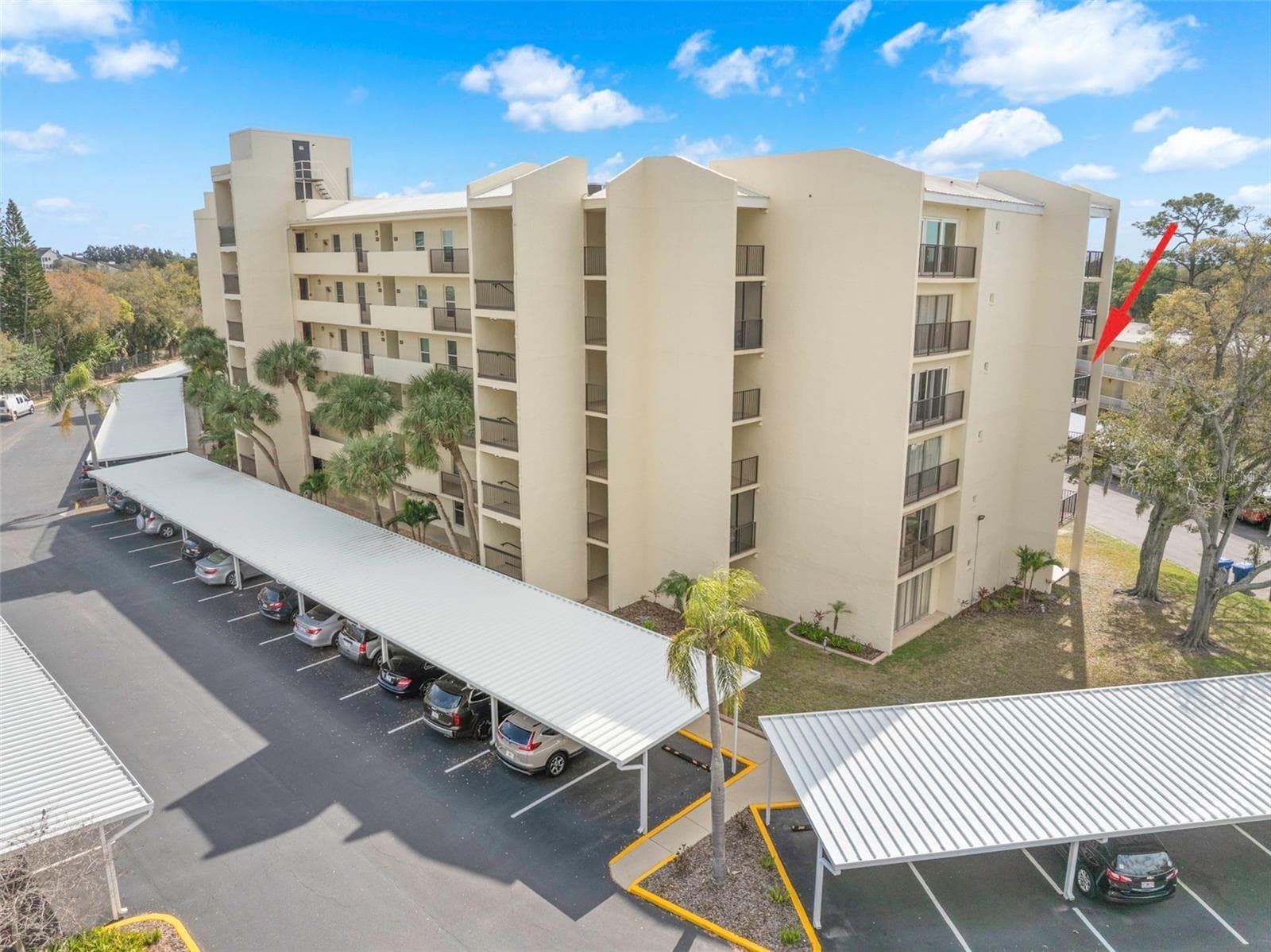 Carport #18 is conveniently located facing the building between the elevator and the stairs. - 225 COUNTRY CLUB DR #F-1401, LARGO