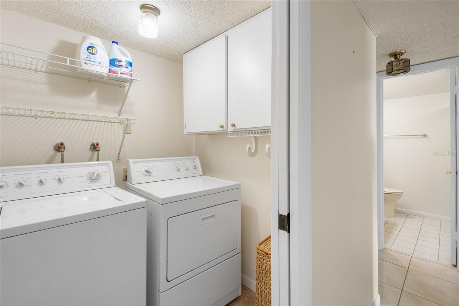 Laundry room with cabinet storage and shelving - 225 COUNTRY CLUB DR #F-1401, LARGO