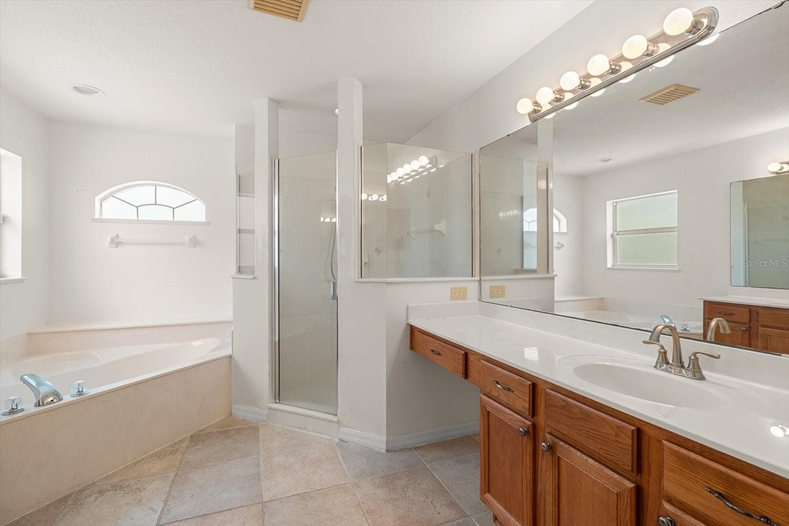 En suite bathroom with double sinks - 4910 SW 109TH LOOP, OCALA