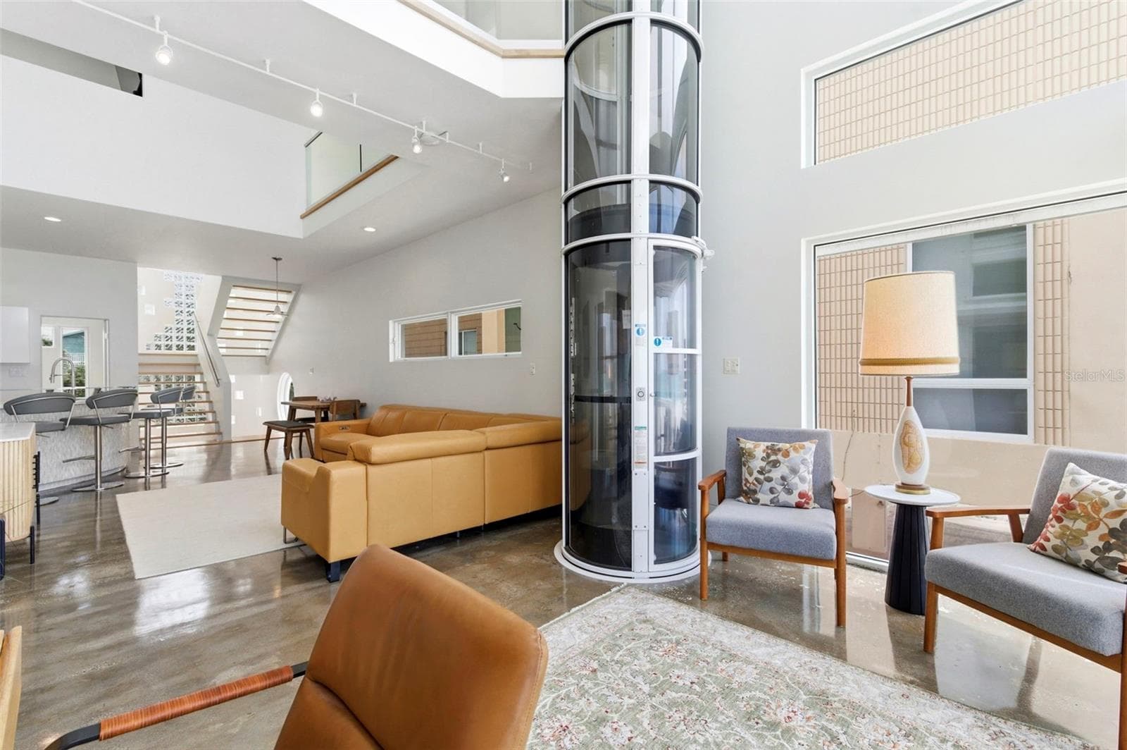 Living Room With Glass Elevator - 8680 W GULF BLVD, TREASURE ISLAND