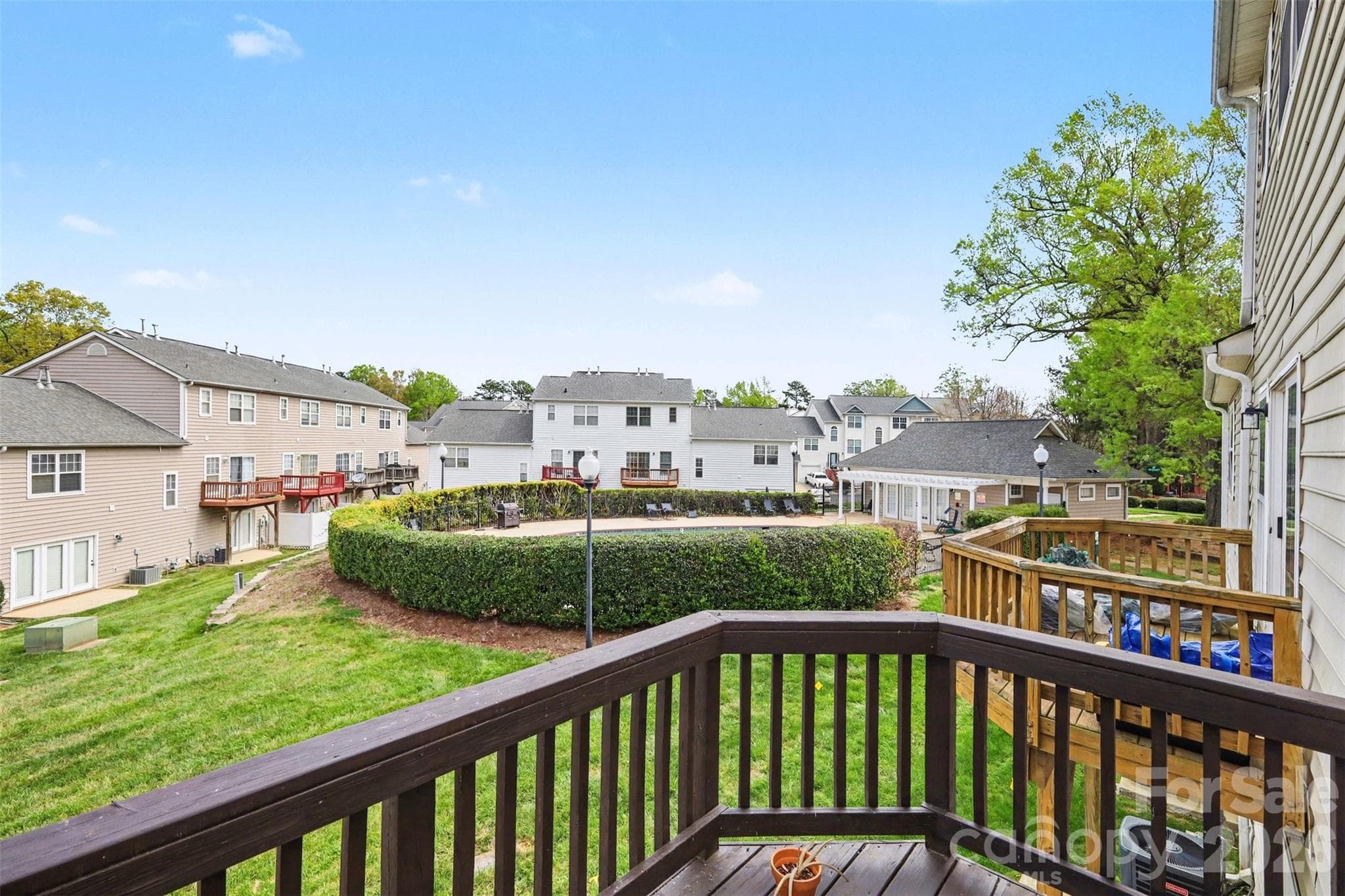 Private balcony overlooking the community pool, perfect for morning coffee or unwinding after a long day. - 2729 Avalon Loop Road, Charlotte