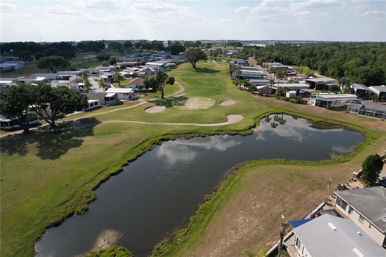 Pond on the course - 402 GOLFVIEW DR, DAVENPORT