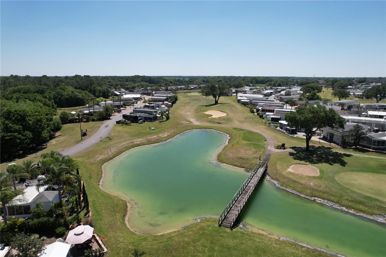 Pond on the course - 402 GOLFVIEW DR, DAVENPORT