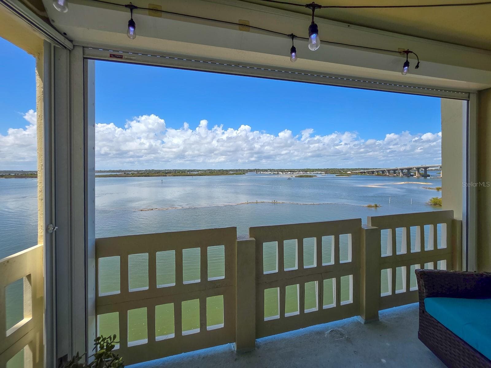 Covered balcony with electric storm shutters. - 3606 S PENINSULA DR #605, PORT ORANGE